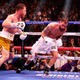 Canelo Alvarez (L) punches Caleb Plant against the ropes during their championship bout for Alvarez’s WBC, WBO, and WBA super-middleweight titles and Plant’s IBF super-middleweight title at MGM Grand Garden Arena.